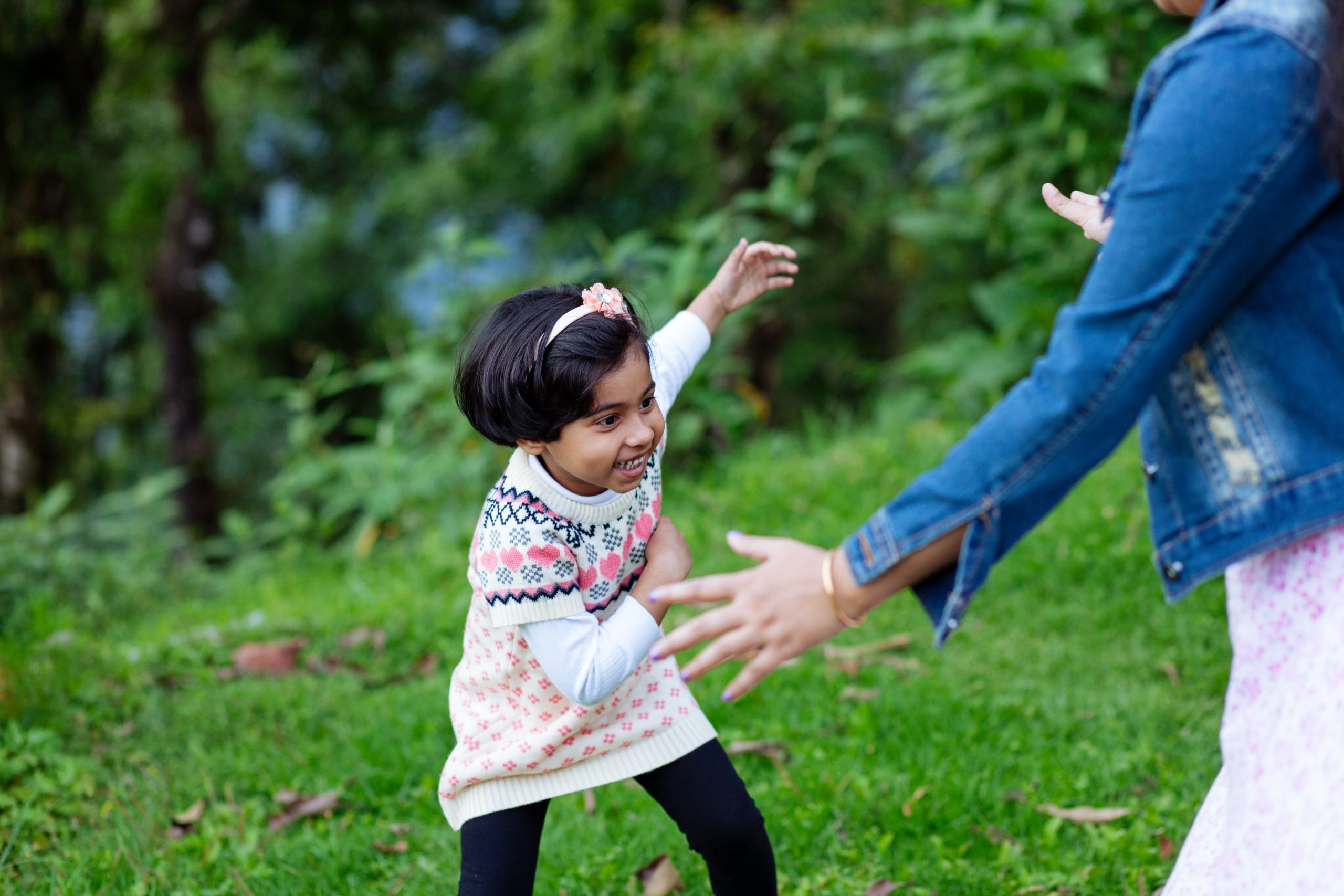 child playing outside with their foster carer
