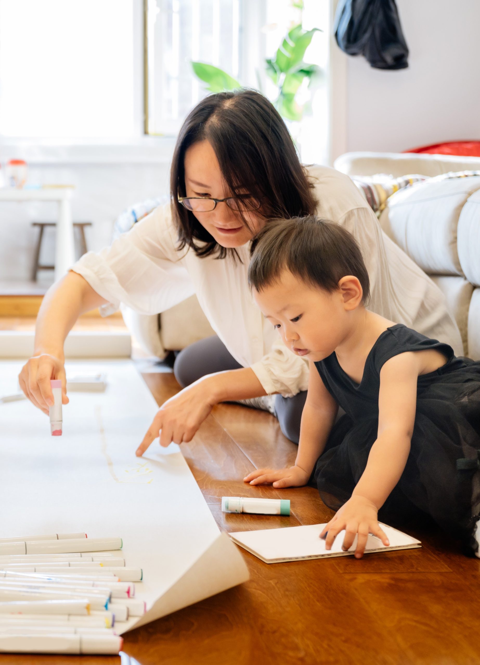 foster carer playing with colours with their foster child